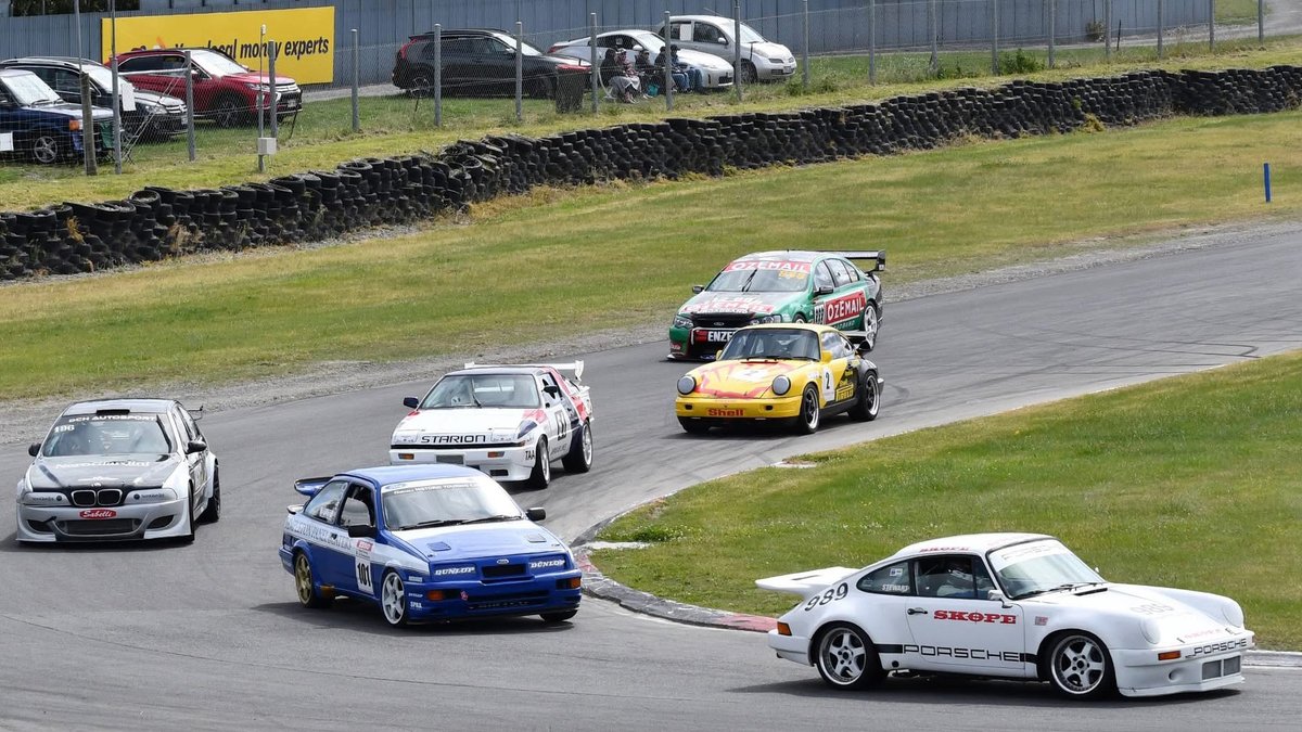 RGuyStewart's tweet photo. This is from the Wigram Revival 2025 held at Euromarque Motorsport Park (Ruapuna) in Christchurch, New Zealand.
Behind me are a Sierra Cosworth, a Porsche 964 RSR, a Mitsubishi Starion, a Ford Falcon V8 Supercar, a BMW M5 and (I think) a Nissan Primera.

https://t.co/YJdkxqbihP https://t.co/ZXih9VdAg5