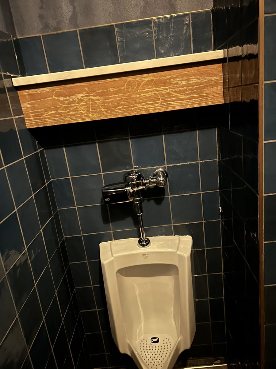 BeaverBasher67's tweet photo. Shelf above a urinal at the bar should be universal https://t.co/AlpDnfyjyY