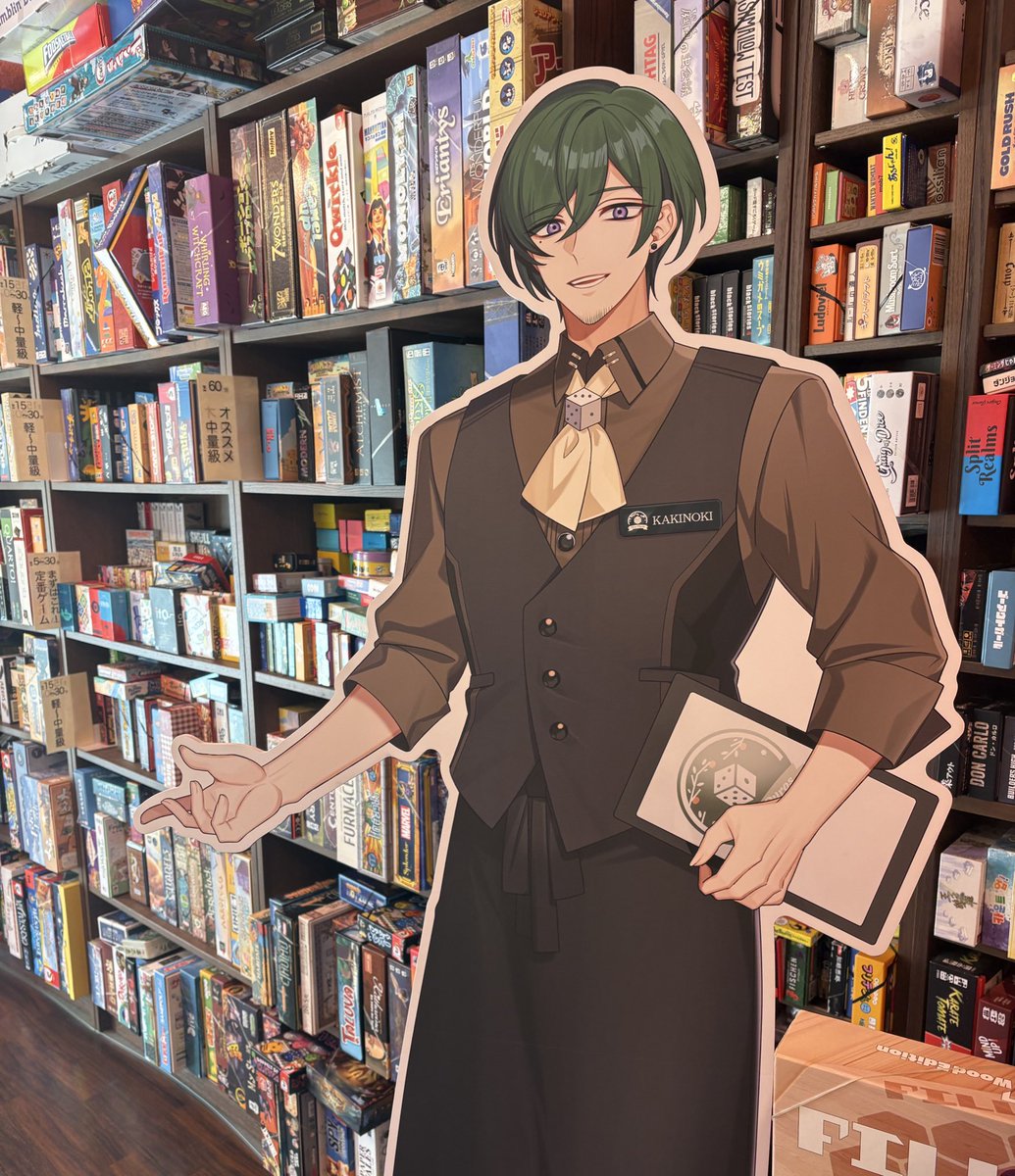 ボードゲームカフェ有明亭に来ました！
きたこし＆柿ノ木すん助のVTuberコラボが開催中でオリジナルコースターがもらえます。
きたこし店長は、２人専用ゲームの棚をカップルに紹介中。柿ノ木すん助さんは、オススメ中量級の棚で紹介をしているようですね。
#ボドカフェVコラボ