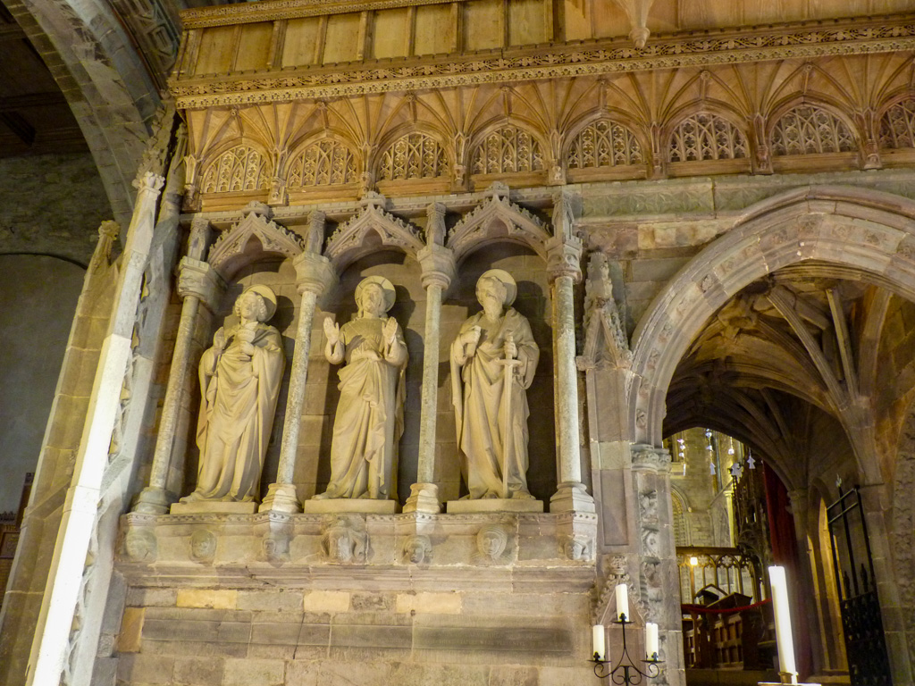 Jones8Pamela's tweet photo. For #StoneworkSunday The elaborate Gothic screen at St David's cathedral was erected by Bishop Gower in the 1340s  Look closely and you will see it is decorated with tiny human heads!  The figures on the screen are of modern date including the statue of St David https://t.co/A0b6c665xf
