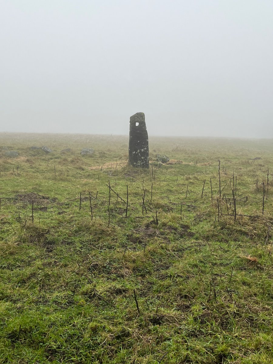 Terrifying occult standing stone in the mist, north yorks moors.