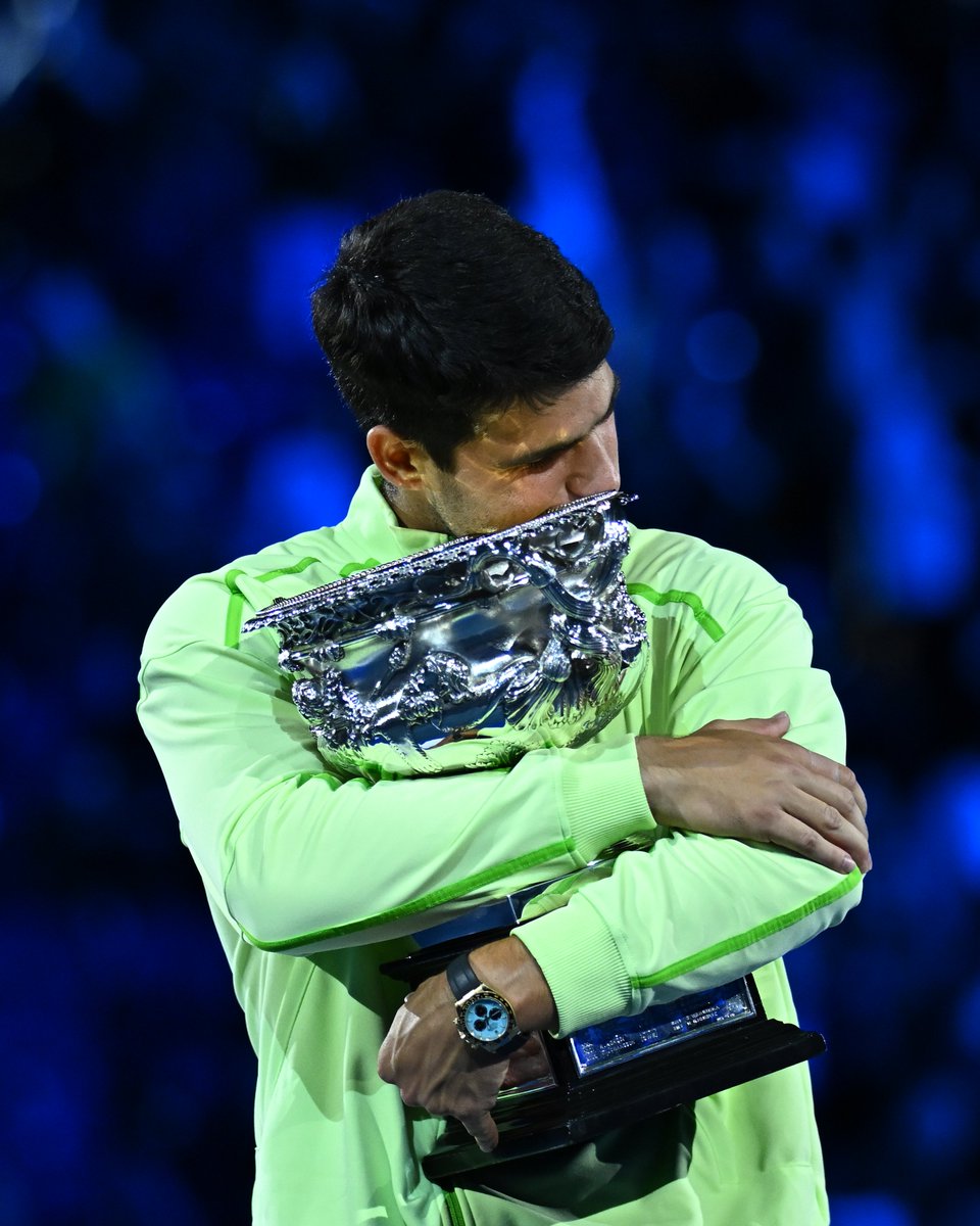 rolandgarros's tweet photo. Holding it tight, it's yours Carlos ✨🏆

#AO26 https://t.co/4D95UDiPF2