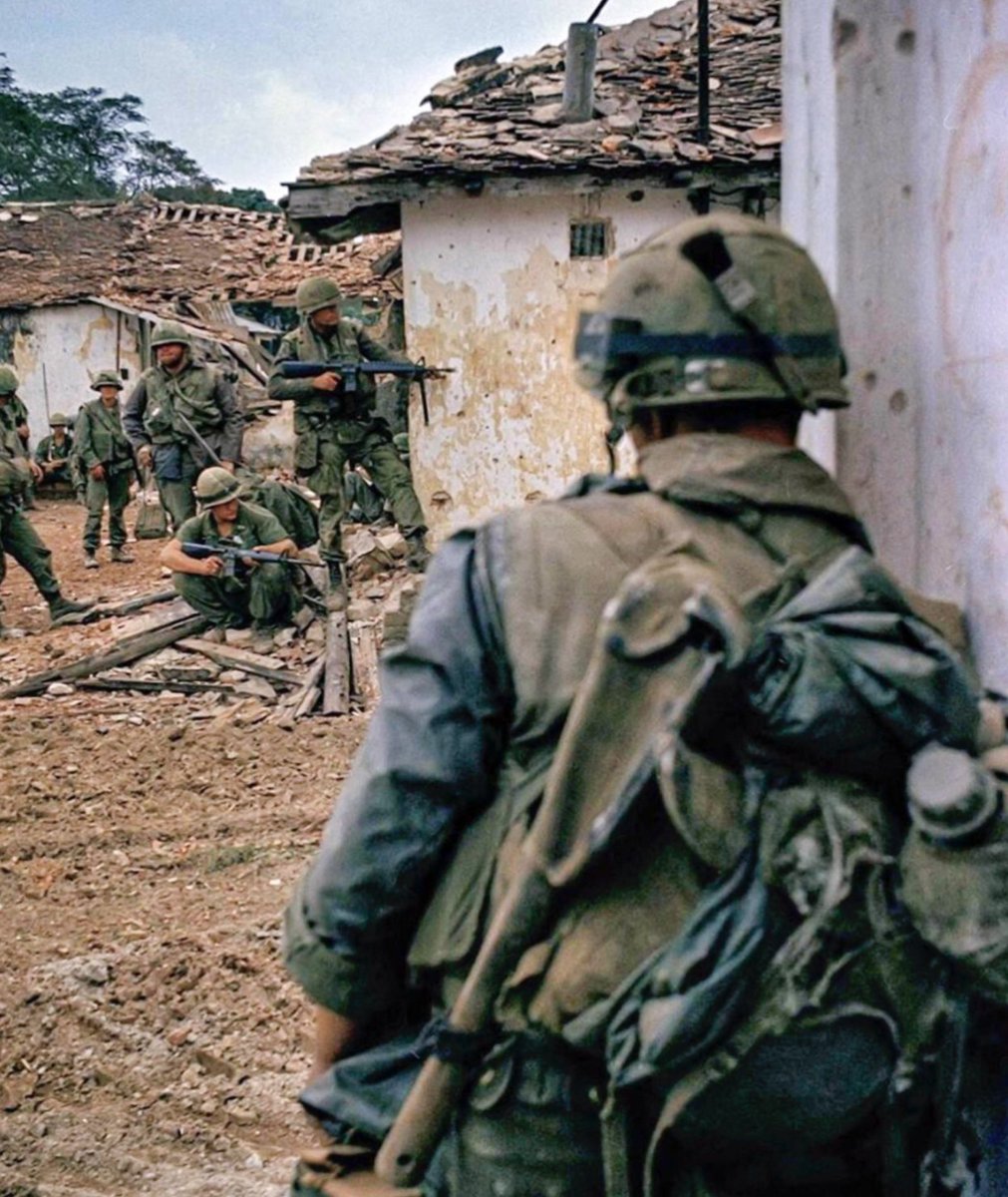 U.S. Marines take cover behind houses as they fight their way deeper into the city, against heavy resistance by NVA forces, during the first days of the Battle of Hue, February 1968. 

(Photo by Art Greenspon, AP)

#USMC #Hue #Vietnam #Military #History #Marines