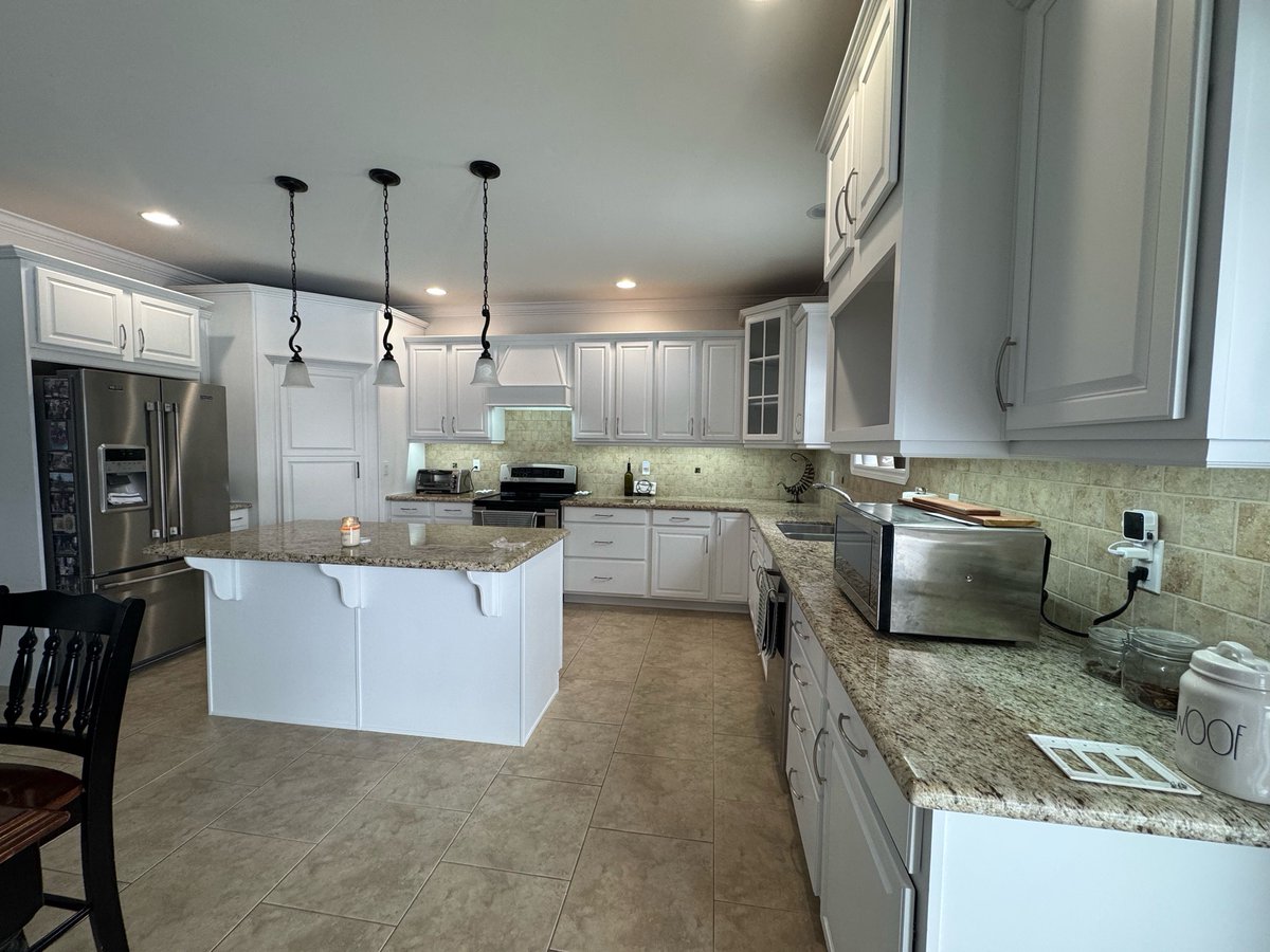 WePaintCabinets's tweet photo. “😩 Tired of that dark, dated kitchen staring back at you every morning?

We transformed their space from heavy &amp; outdated → bright, fresh, timeless in just days (no demo, no dust apocalypse, no full reno hassle!).
Tap ‘Message Us’ right now for a FREE quick quote https://t.co/MlZ73LTjcJ