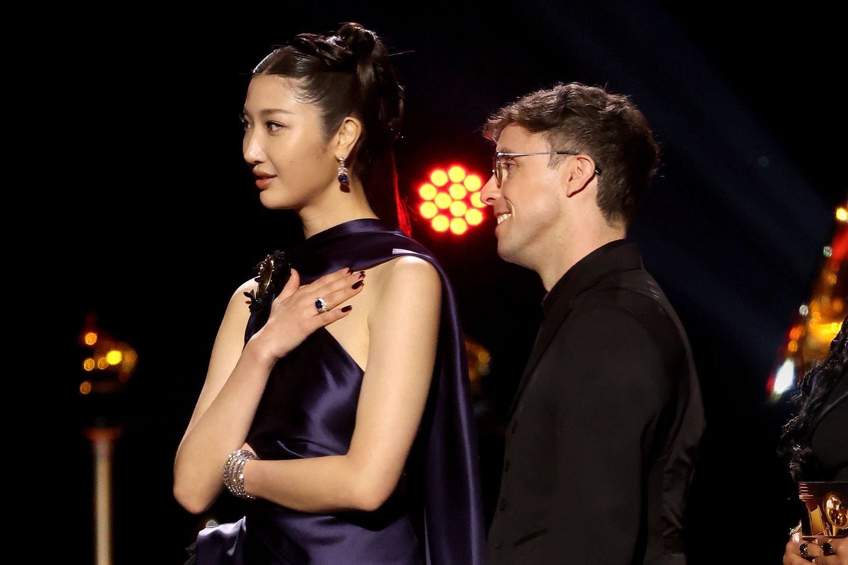 EJAE and Mark Sonnenblick accepts the Best Song Written For Visual Media award for "Golden — From KPop Demon Hunters" onstage during the 68th GRAMMY Awards Premiere Ceremony