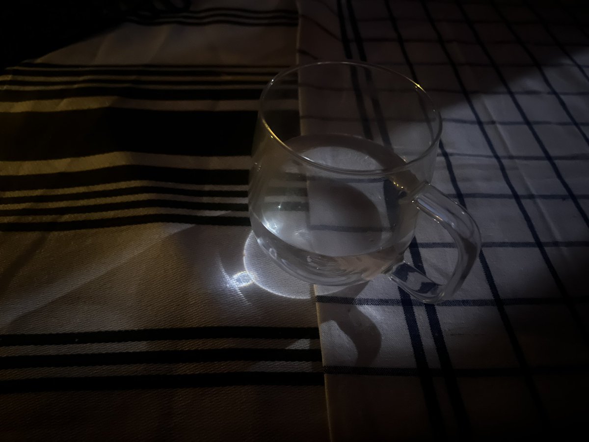 Full moon refracting through my glass of water which I will, of course, take as a sign