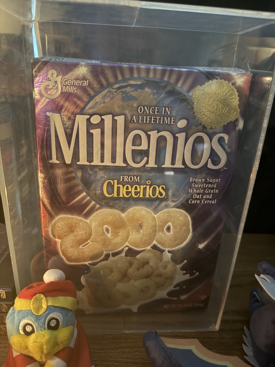 Ok, so I was on a day trip out of town today and I made quite possibly my goofiest purchase from an antique store: a preserved box of Millenios.

It now sits on top of my CRT cabinet, looming like a grim $16 corn puffed raven