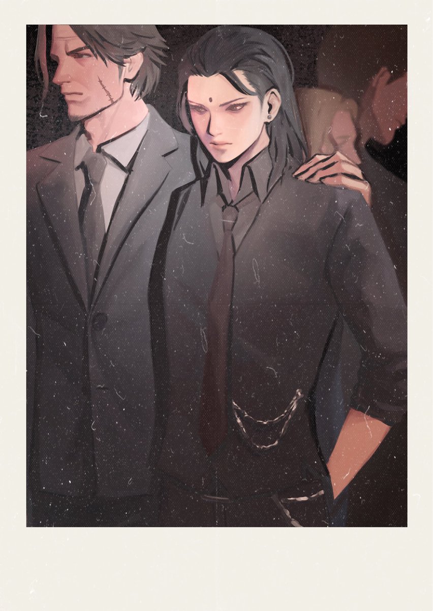 Eyeliner, ear studs, long hair and suit chains.