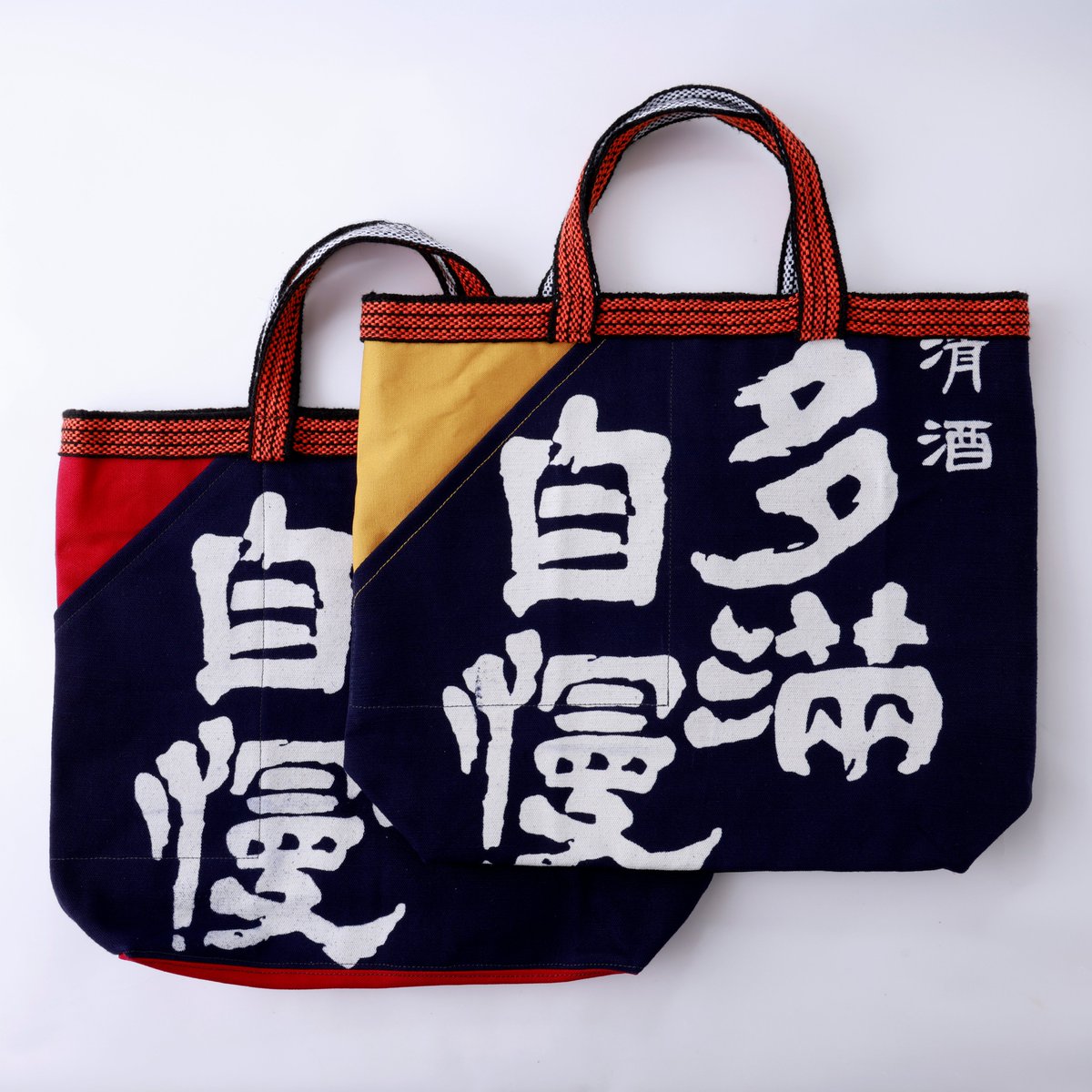 こちらは、直売店 酒世羅限定の多満自慢前掛けかばん。柄（中の柄も