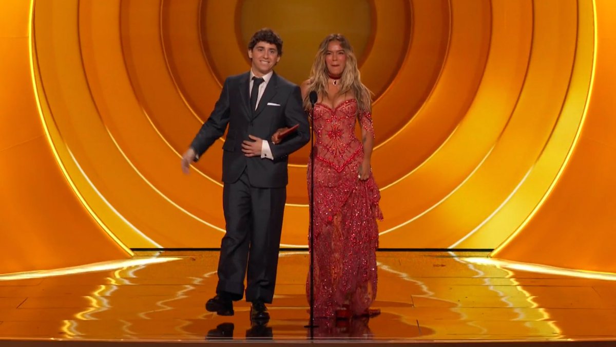 Marcelo Hernandez and Karol G on stage to announce Bad Bunny as the winner. #GRAMMYs
