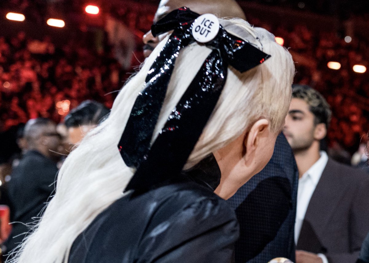 gagadaily's tweet image. Lady Gaga was spotted wearing an “ICE OUT” pin in her bow at the #GRAMMYs