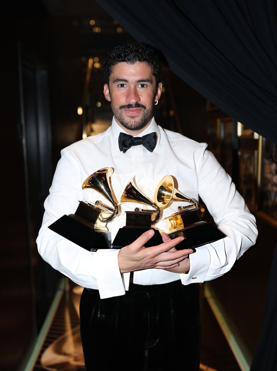 AccessBadBunny's tweet image. Bad Bunny with the three #GRAMMYs he won today, including "Album of the Year".