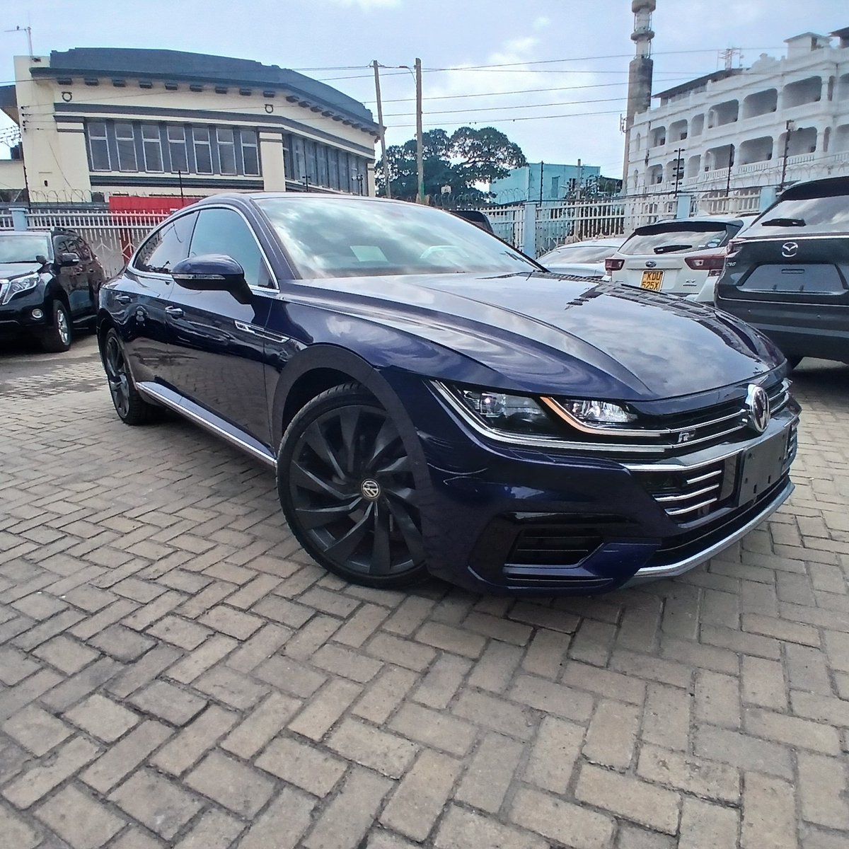 KAutozone's tweet photo. *Volkswagen Arteon 4M RLine Dynaudio Edition*
Year: 2018  
Engine: 2000cc Petrol    
Transmission: 7-speed Dual-Clutch Automatic  
Drive: 4WD (4Motion)  
Colour: Navy Blue 
Mileage: 66000 KM
Registration: New

*Features:*
 •   Sunroof 
 •   RLine Sports Leather Seats Interior 
 •   Premium Dynaudio Sound    System 
- Keyless Entry & Start
- Heated Front Seats 
- Front Power Seats with Memory Function 
- Remote Windows & Sunroof opening
- Power Folding Side Mirror
- Power Liftgate
- Acoustic Lock/Unlock Signal 
- Engine Run Lock
- Off-Road Information Display
- Driving Mode Selection 
- Heads-up Display
- Sports Digital Instrument Cluster 
- Gloss Black Accents and R-Line badging
- Rear Black Accent Spoiler
- LED Ambient Lighting 
- Adaptive LED Headlamps
- LED Taillights 
- LED Daytime Running Lights
- Touchscreen Infotainment System
- Wireless Charging Pad
- Apple CarPlay & Android Auto 
- USB Port 
- Bluetooth Connectivity, FM Radio  
- Rear-View and 360° HD Camera 
- Adaptive Cruise Control  
- Front Assist 
- Lane Assist 
- Blind Spot Monitoring System  
- Driver Alert System  
- Paddle Shifters  
- Electric Handbrake 
- Auto Hold Function 
- Multi function steering wheel
- Factory Dark Graphite Alloy wheels
- 3-zone Climate Control  
- Rain-Sensing Wipers 
- Tire Pressure Monitoring System
