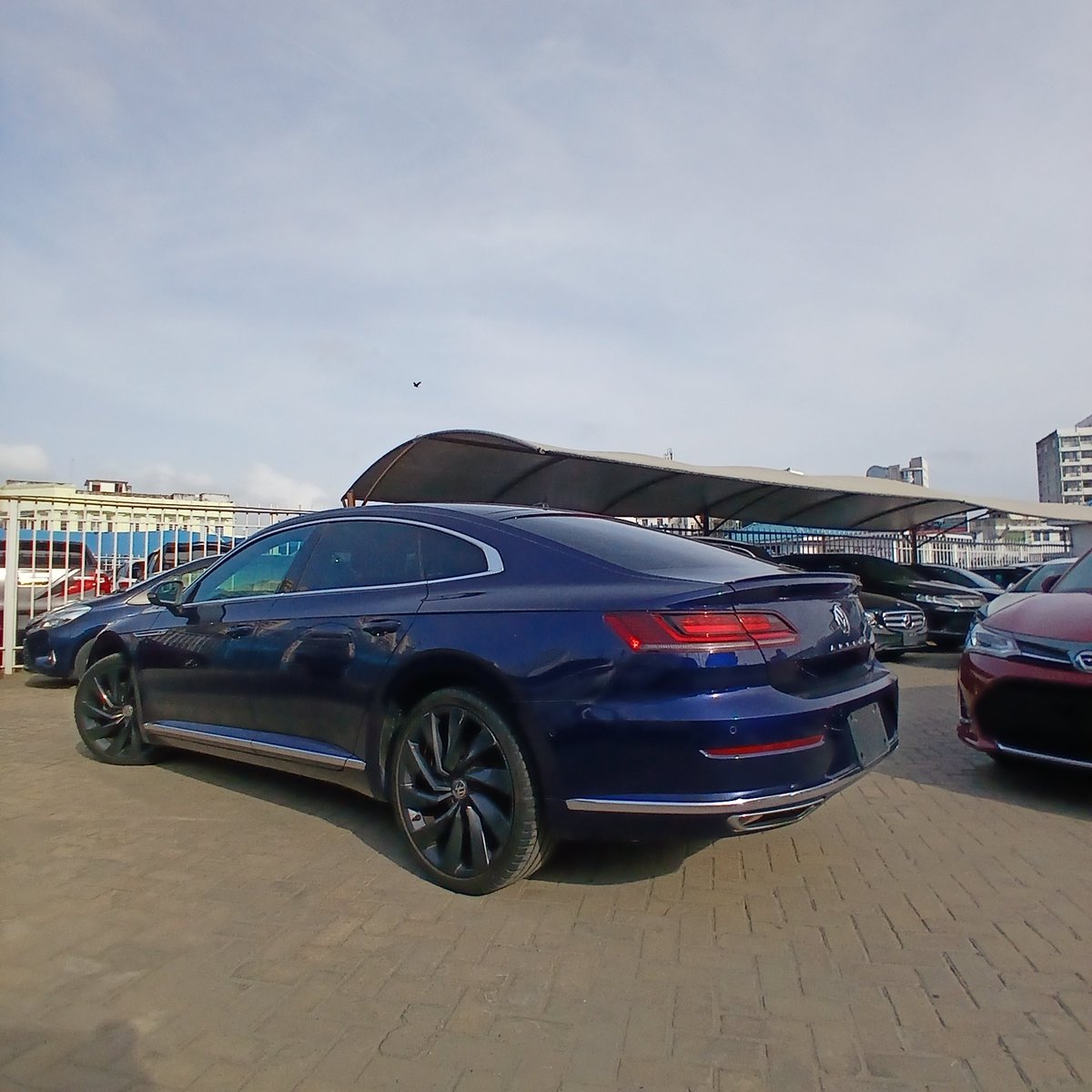 KAutozone's tweet photo. *Volkswagen Arteon 4M RLine Dynaudio Edition*
Year: 2018  
Engine: 2000cc Petrol    
Transmission: 7-speed Dual-Clutch Automatic  
Drive: 4WD (4Motion)  
Colour: Navy Blue 
Mileage: 66000 KM
Registration: New

*Features:*
 •   Sunroof 
 •   RLine Sports Leather Seats Interior 
 •   Premium Dynaudio Sound    System 
- Keyless Entry & Start
- Heated Front Seats 
- Front Power Seats with Memory Function 
- Remote Windows & Sunroof opening
- Power Folding Side Mirror
- Power Liftgate
- Acoustic Lock/Unlock Signal 
- Engine Run Lock
- Off-Road Information Display
- Driving Mode Selection 
- Heads-up Display
- Sports Digital Instrument Cluster 
- Gloss Black Accents and R-Line badging
- Rear Black Accent Spoiler
- LED Ambient Lighting 
- Adaptive LED Headlamps
- LED Taillights 
- LED Daytime Running Lights
- Touchscreen Infotainment System
- Wireless Charging Pad
- Apple CarPlay & Android Auto 
- USB Port 
- Bluetooth Connectivity, FM Radio  
- Rear-View and 360° HD Camera 
- Adaptive Cruise Control  
- Front Assist 
- Lane Assist 
- Blind Spot Monitoring System  
- Driver Alert System  
- Paddle Shifters  
- Electric Handbrake 
- Auto Hold Function 
- Multi function steering wheel
- Factory Dark Graphite Alloy wheels
- 3-zone Climate Control  
- Rain-Sensing Wipers 
- Tire Pressure Monitoring System