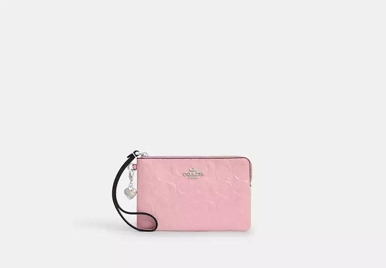Sneaky_Steals's tweet photo. COACH Corner Zip Wristlet In Signature Leather With Heart Charm is only $35! https://t.co/ECBklSpYer #ad https://t.co/LJaewNP6z8