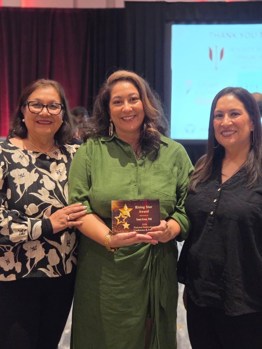 I’m incredibly grateful to have been recognized as a Rising Star by the National Multicultural Conference &amp; Summit this past week. Thank you, <a href="/NMCSummit/">National Multicultural Conference & Summit</a>, for seeing me. I’m honored to be walking this path with you all.
Here I am with my mom and sister cradling my award.
