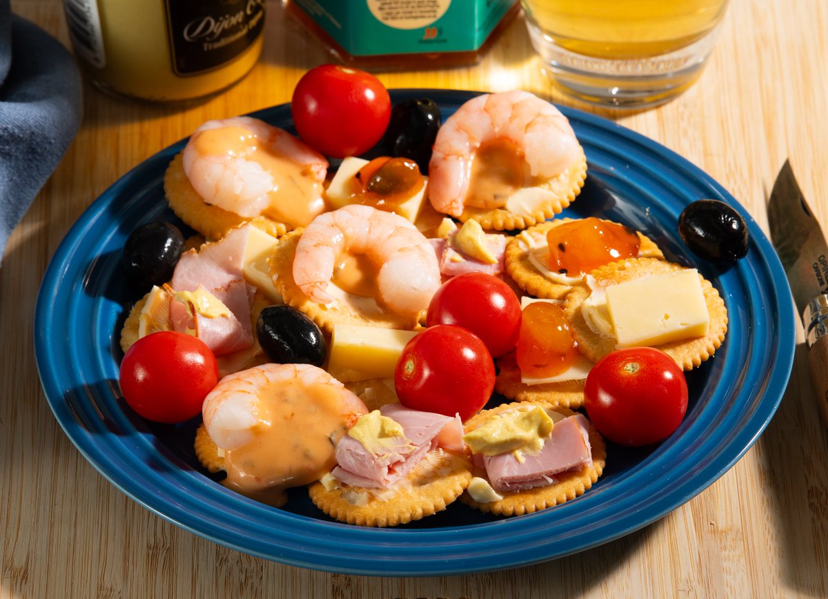 My TV snacks for this evening:

Buttered Ritz Crackers with Brunswick Ham, Cheddar Cheese, Dijon Mustard, Thousand Island Dressing, Mango Chutney, King Prawns, Vittoria Cherry Vine Tomatoes, Black Olives and a glass of Neck Oil Session IPA.