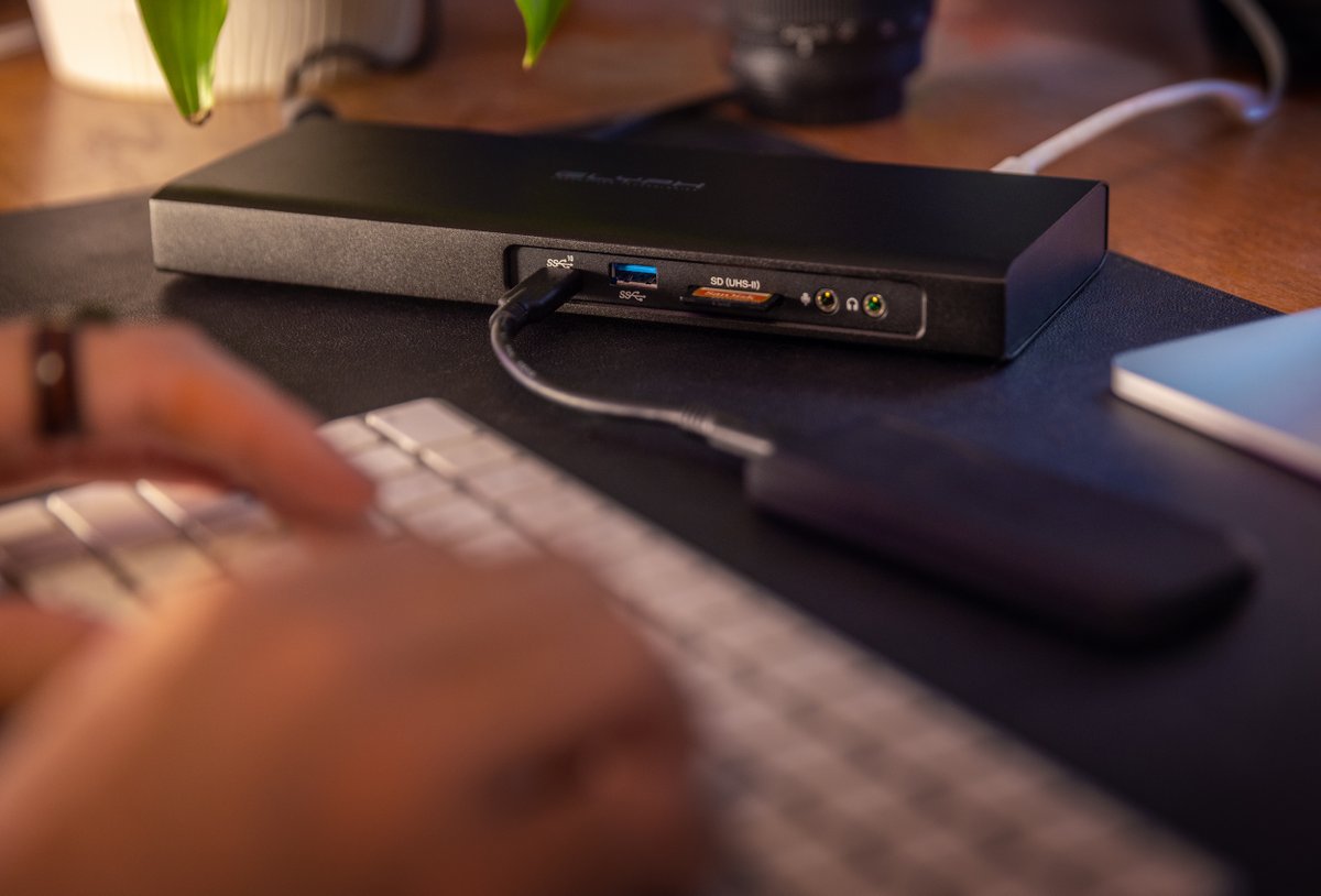 A messy workspace breaks the creative flow. We built this dock to be the brain of your desk, making every transfer faster. Our favorite feature is the internal NVMe SSD slot, which puts massive storage inside the dock so you can clear extra drives and focus on your edit.