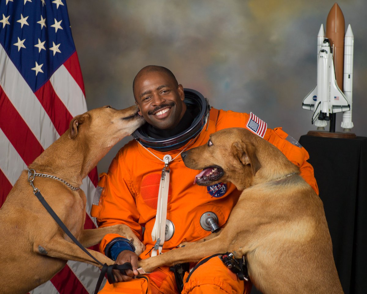 Astronaut Leland Melvin snuck his two rescue dogs into his official NASA portrait