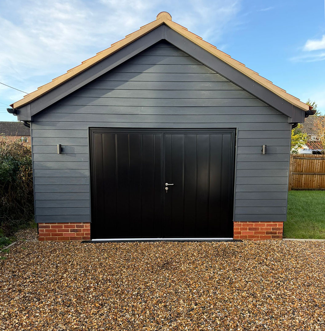 easterngroupuk's tweet photo. An aesthetically pleasing upgrade near Drinkstone Green, Suffolk: a  #teckentrup  #sidehingedgaragedoor,  perfectly set against a barn‑style garage with grey wood cladding. A clean, classic contrast that suits the building beautifully. #GarageDoorIdeas https://t.co/gEiwL10CL5