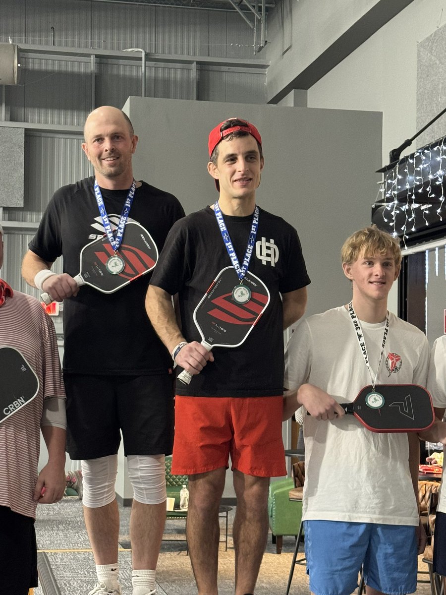 Coach_Lewin's tweet photo. Icicle Open 4.0 Champs! Mike Polet was a beast all day!  We had some great rallies and games.  The Friendly Pickle was a great venue and created a great tournament atmosphere.  

And yeah… 👀
Take a close look at the podium…
Two #BoomSticks on top. Coincidence? I think not. https://t.co/YuBUOVEp31