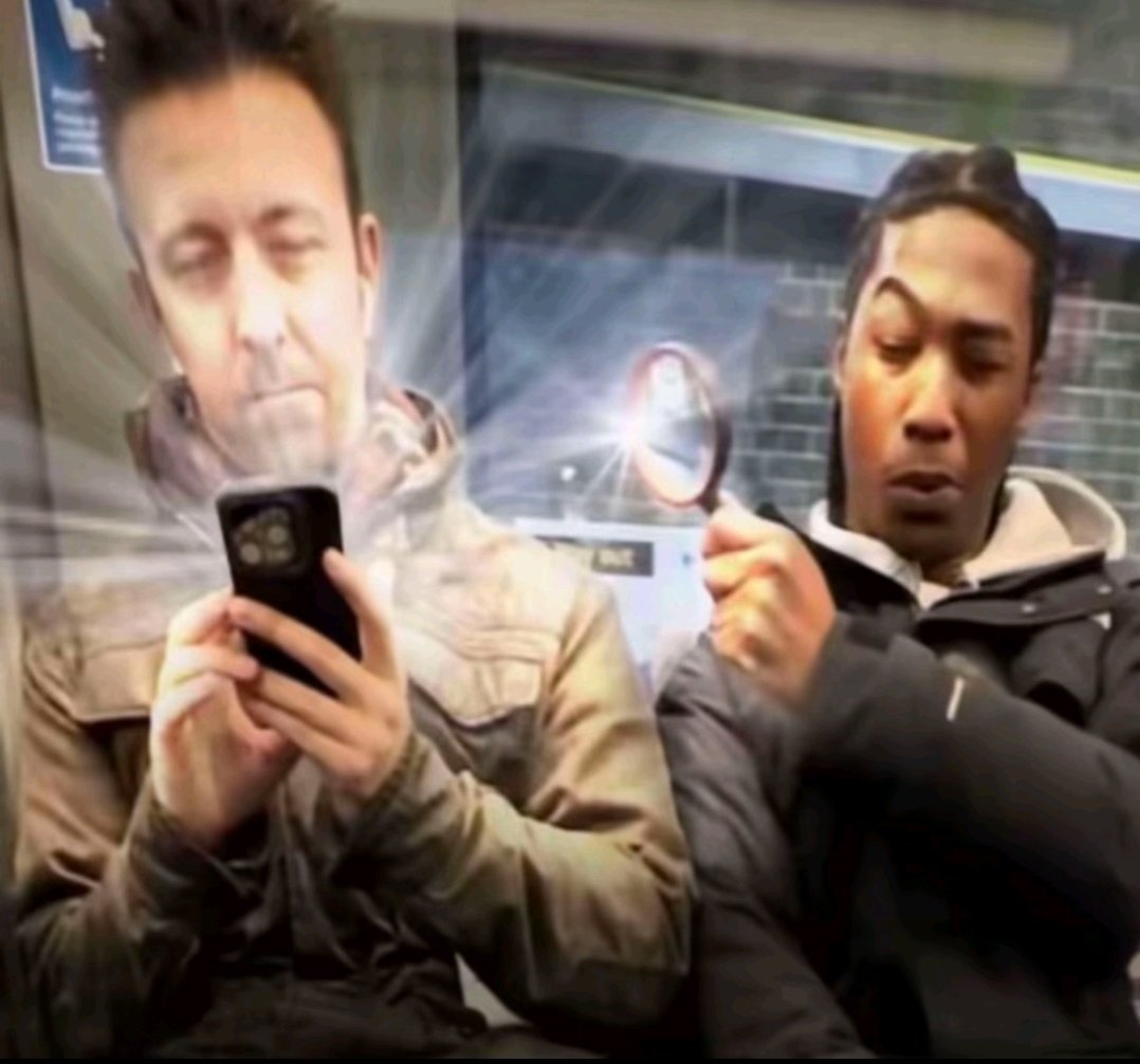 360PERCENT's tweet photo. Looking at stranger's phones on the subway tiktok harmless prank black guy holding up magnifying glass gem nosy edited reaction picture curious peeking at phone red arrow diamond emoji https://t.co/D0UhqNlzda
