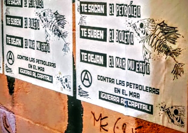 "Te sacan el petróleo, te suben el boleto, te dejan el mar muerto. Contra las petroleras en el mar ¡Guerra al Capital!" visto en las calles de Montevideo.