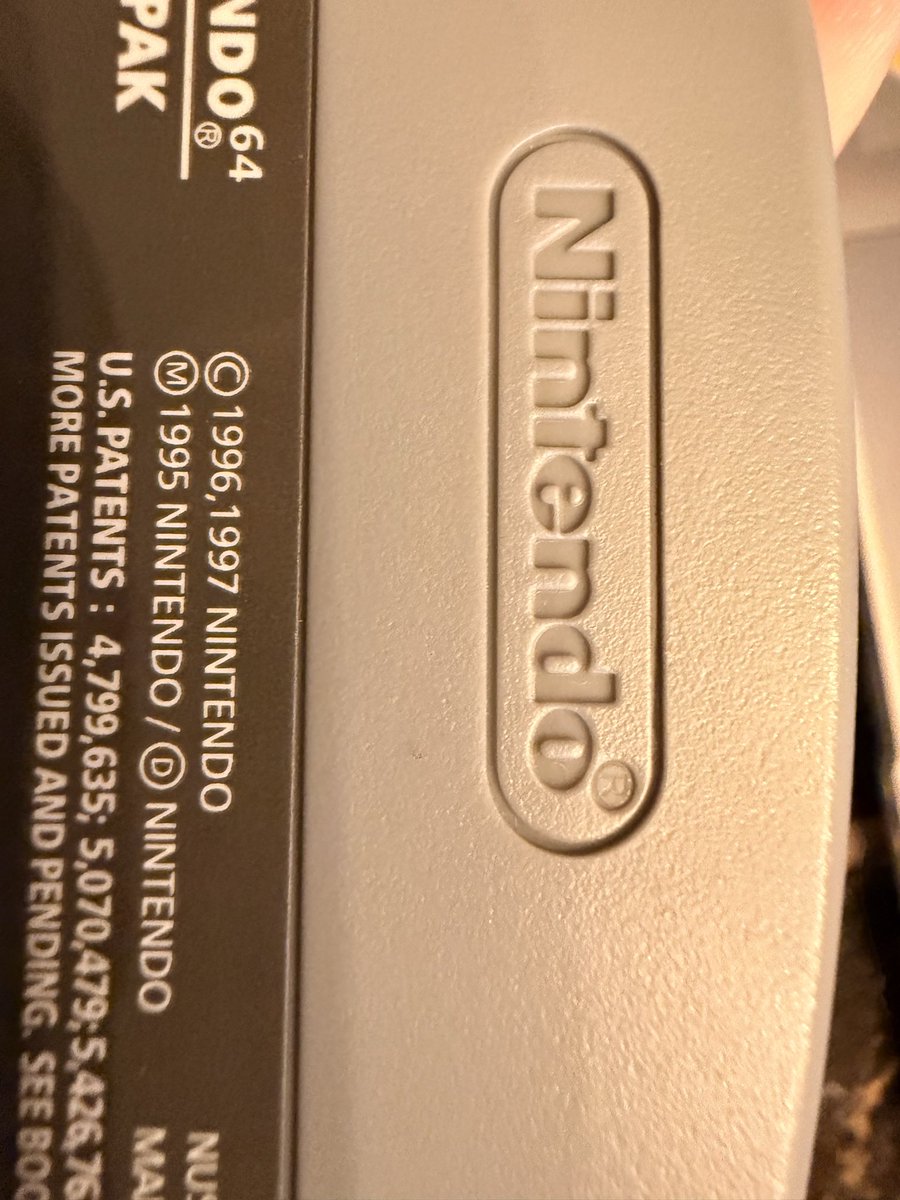 FilmgirlCybyrd's tweet photo. The evidence that it’s fake is actually very easy to see if you have any common knowledge of N64 games . First the label is new on 30+ year old game 2) the Nintendo logo circle with R is too big and 3)the back logo is glossy instead of matte 

@mercari_app it’s a fake https://t.co/u2uLBmcrNT