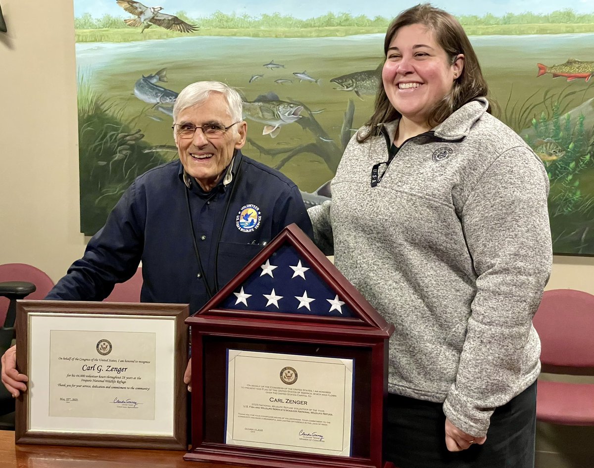Allison Barkowski of Greece, right, operations and outreach director for Rep. Claudia Tenney, R-NY, visited Iroquois NWR today and met with refuge staff and volunteer Carl Zenger, left, who showed off the case he had built for the Capitol flag Tenney gave him in the fall.