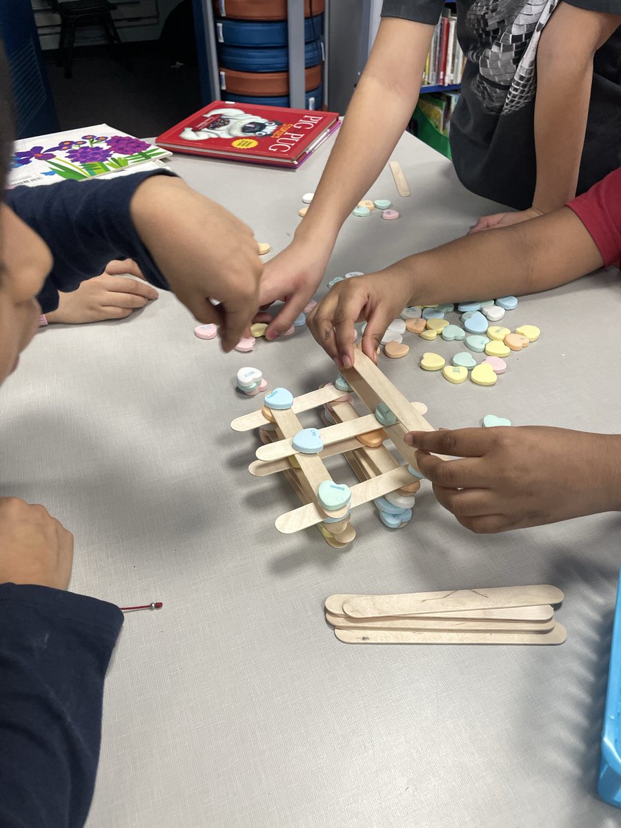 At the library this week, K-2 will prepare for the holiday by listening to, "Grumpy Monkey: Valentine Gross-Out" 🐵 K-1 will work on some fun crafts &amp; grade 2 will have a STEM challenge to build the tallest tower using candy hearts &amp; craft sticks 💝