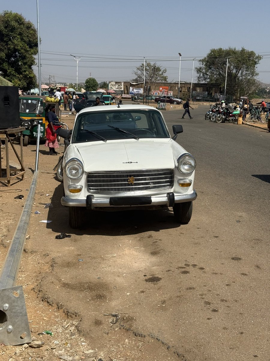 Spotted is beautify in Jos .1960 Peugeot 404