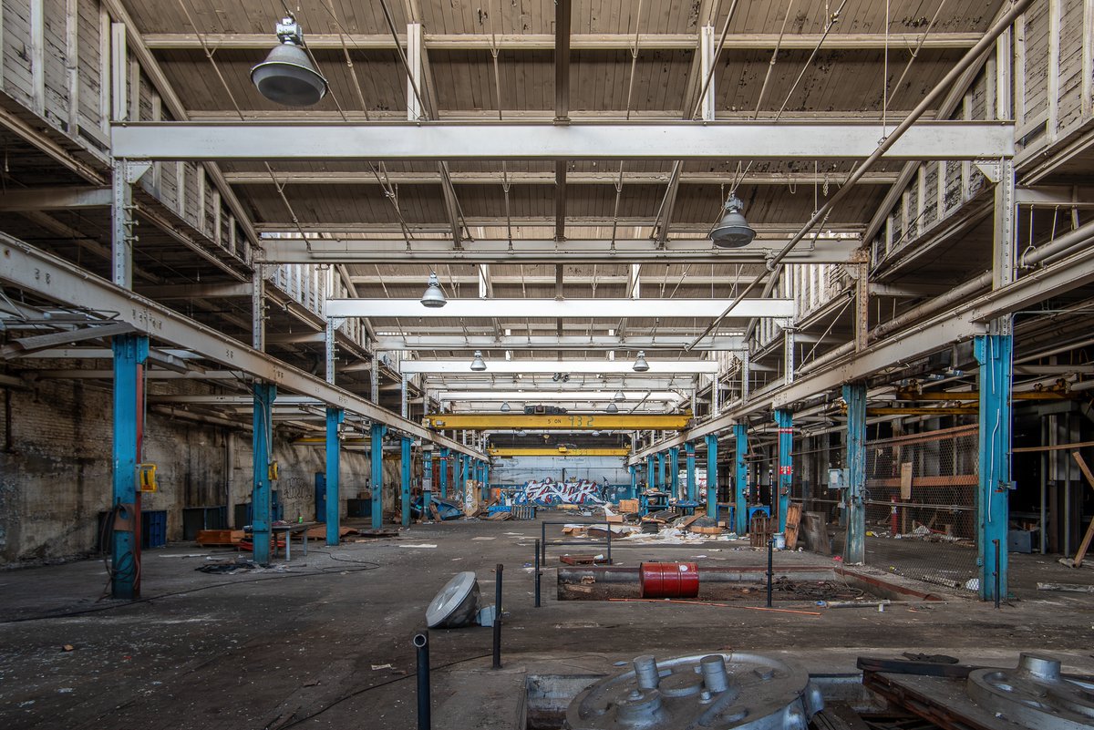 Defunct Machine Four views of a defunct and abandoned tire factory somewhere in the ...