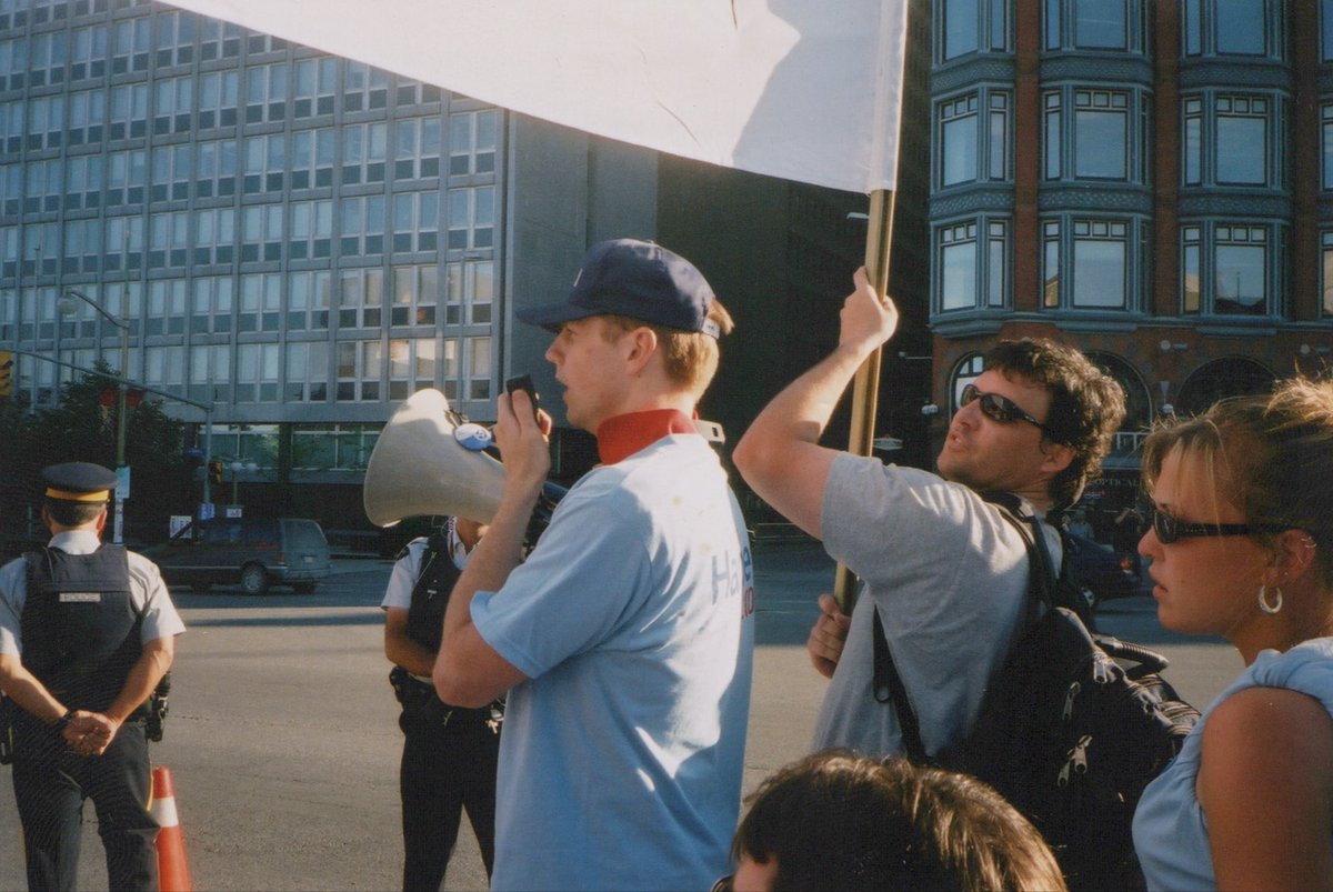 leifmalling's tweet photo. @agalbraith @_MicheleAustin @DennisJMatthews @stephenharper This guy was making a lot of noise outside the 2004 debate venue. https://t.co/guS46Fk0R2