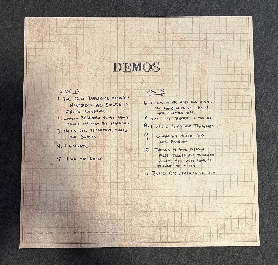 riverofyou's tweet image. oh my god someone posted the back of the demos vinyl on reddit and the tracklist is in BRENDONS HANDWRITING 😭😭😭
