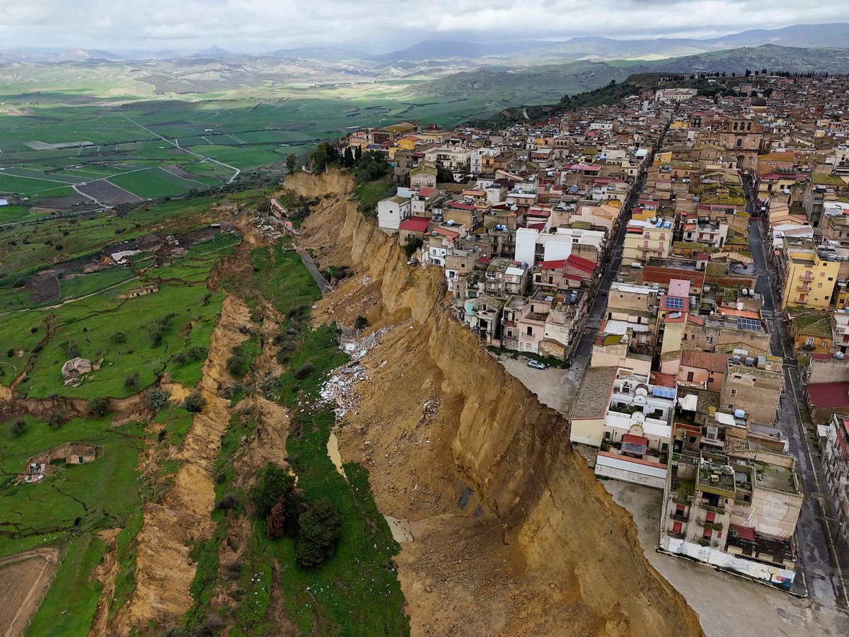 Incredible photos of the Sicilian town clinging to the edge of a cliff post-landslide. reuters.com/pictures/lands…