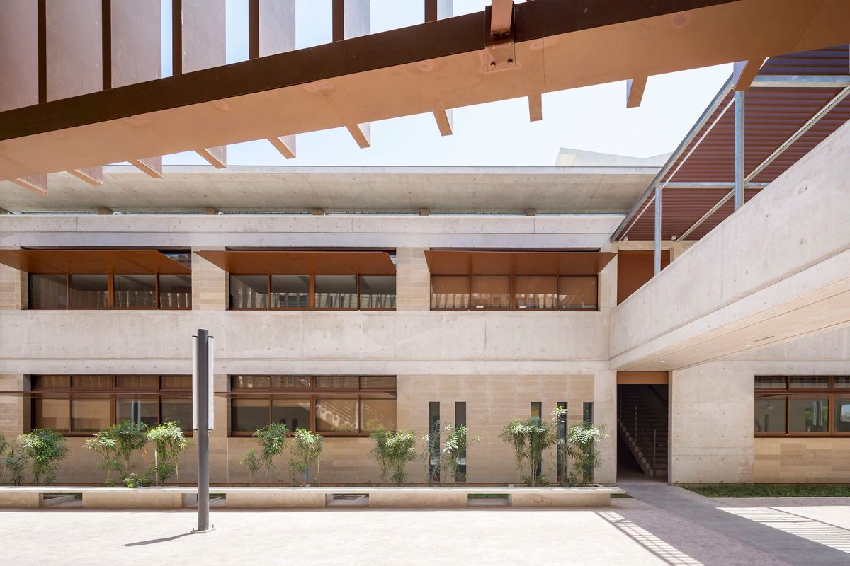 Archello's tweet photo. Designed for extreme heat, the Lycée Français Joseph Kessel by R plus S Architecture relies on wind, mass, and shade rather than machines.
https://t.co/4SbwyZxE6u
#PassiveDesign #BioclimaticArchitecture #ClimateResponsive https://t.co/fKVrgPRbXY