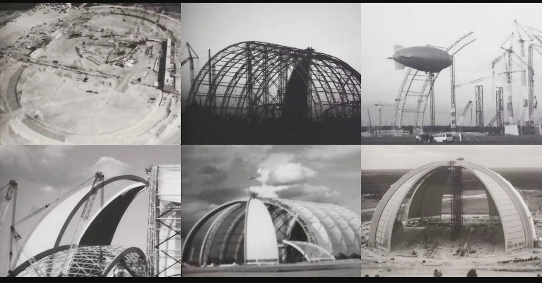 The Aerium hangar is also known as the CargoLifter AG hangar and more recently as "Tropical Islands," the waterpark it now houses. 

This waterpark (former hangar) is located to the South of Berlin on what was originally the "Brand-Briesen Airfield" built for the Luftwaffe.