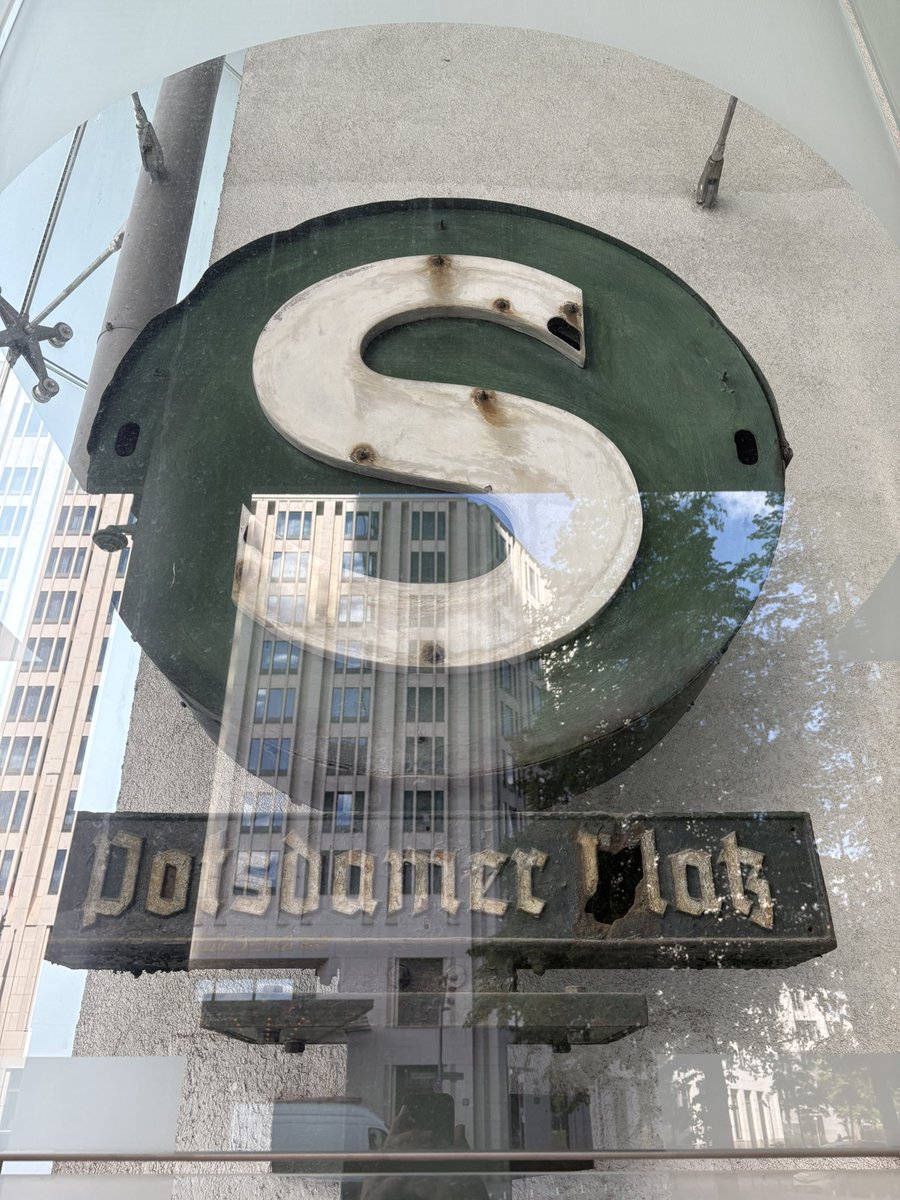 In the North West corner of Potsdamer Platz, at the entrance to the DB building is an almost forgotten relic of WW2. An original, shrapnel scarred S Bahn sign which stood at the station entrance in a once beautiful part of the city, later ravaged by WW2 and the Cold War.