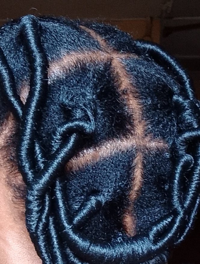 The beauty of African threading. Made by my mom. I love how she made it loose so I wouldn't feel too much pain.