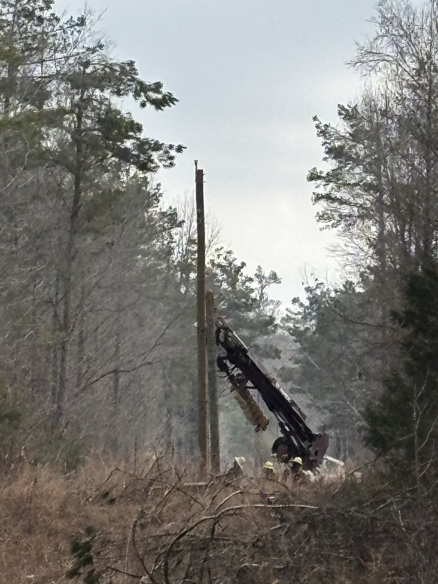 This crew is replacing a broken pole and restoring power on Johnson Quarters Road.
