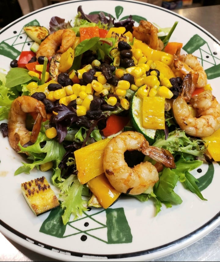 BackDoorBakery2's tweet photo. Craving something fresh and zesty? 🍤🥗 Try our Southwest Shrimp Salad at The Back Door Bakery &amp; Cafe! Enjoy a mix of greens, grilled veggies, lime sautéed shrimps and a kick of spicy jalapeno cilantro dressing. #HealthyEats #FoodieAdventure https://t.co/EkGaJyBkGg
