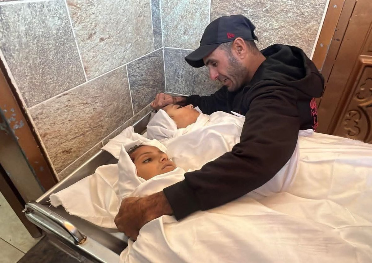 In this picture, he embraces his daughters for the last time, today.

And the question remains: How many more children must die before the Holocaust stops?