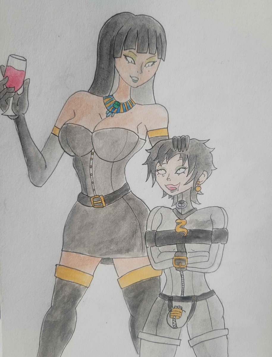 I'm back, and now with a new post: A beautiful dominatrix with her new toy, who seem to be having a very good time together