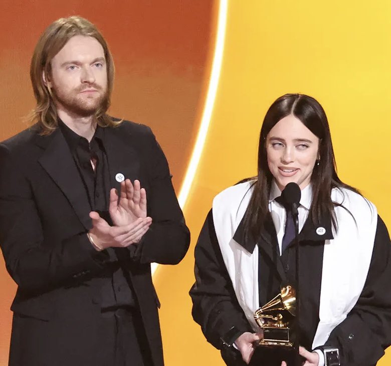 PopCrave's tweet image. FINNEAS defends sister Billie Eilish amid online backlash over her anti-ICE comments at GRAMMYs:

“Seeing a lot of very powerful old white men outraged about what my 24 year old sister said during her acceptance speech. We can literally see your names in the Epstein files.”