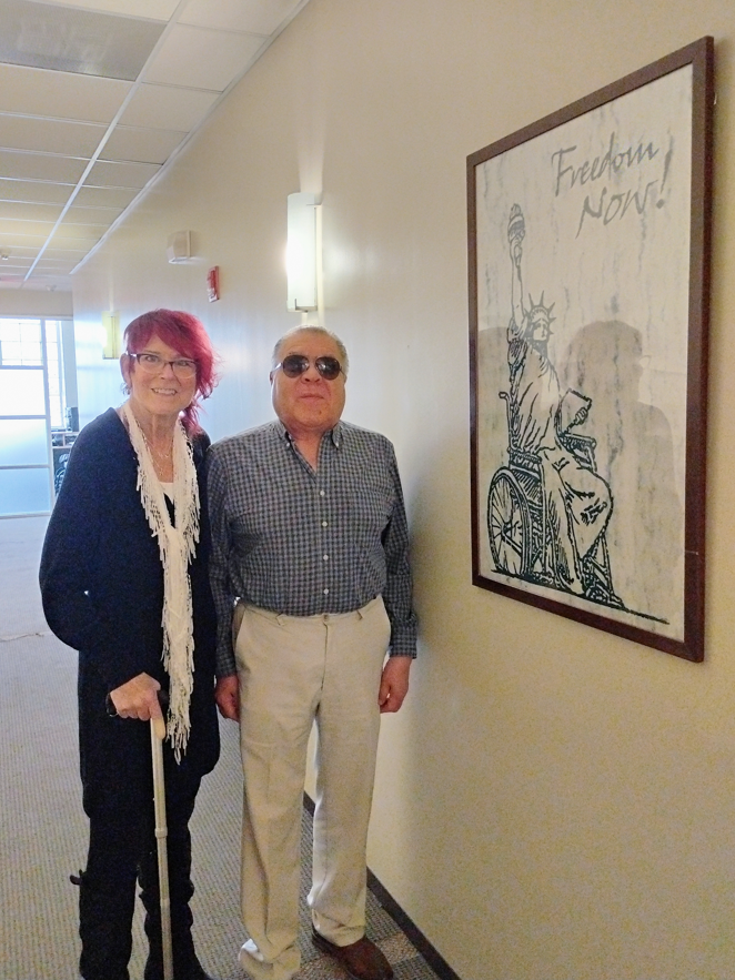 Progress Center's first Executive Director Robin Jones joined the Blue Island Disability Committee to discuss ADA Transition Plans. She is pictured here with our current ED Horacio Esparza next to a drawing of the Statue of Liberty using a wheelchair with the words "Freedom Now!"