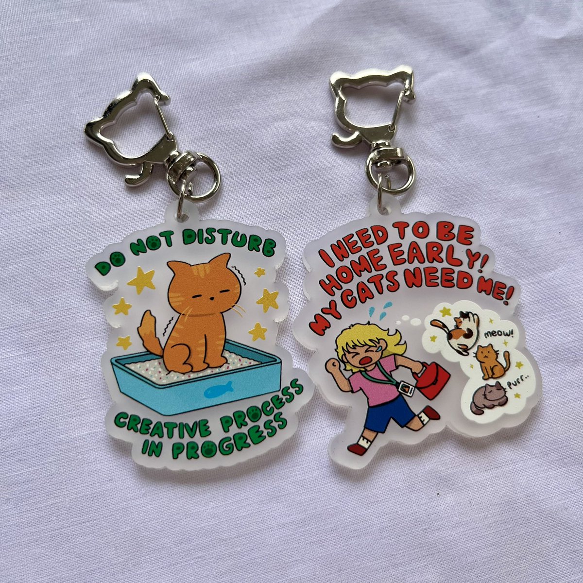 my fav merch gotta be my glitter pocket mirror and cats owner keychain! these are always best sellers on art market too! 

sering jadi ngobrol lucu soal kucingku &amp; buyer ketika mereka beli keychain ini :3