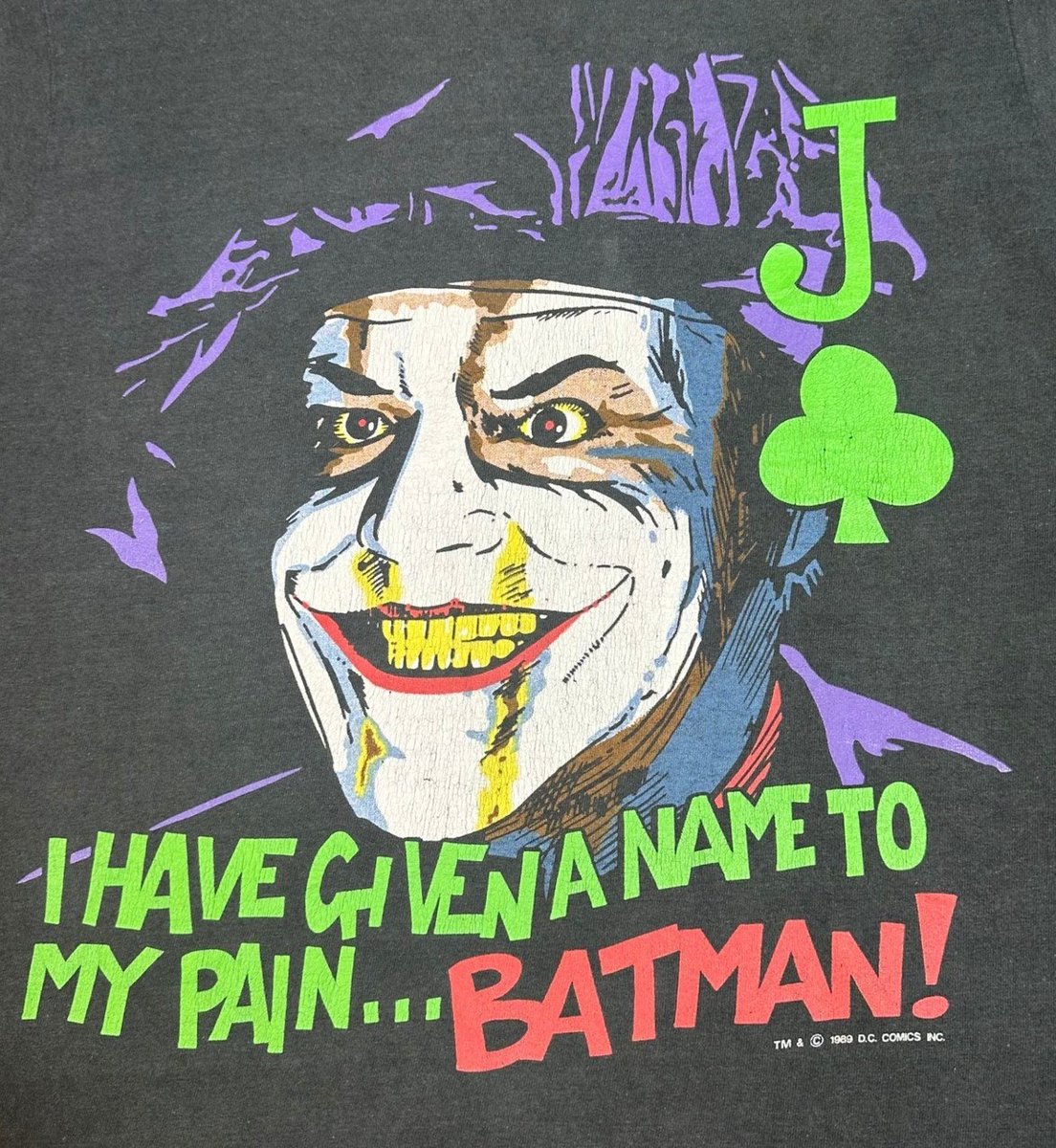 BatmanAnthology's tweet photo. Photos of a Batman (1989) Joker T-Shirt, featuring some creepy artwork of Joker in his Artist's Beret with most of his Jack Napier disguised washed off. It also features an abridged ver. of one of his iconic lines from the film "I have Given a name to my pain... Batman" https://t.co/8EgVeSTCOn