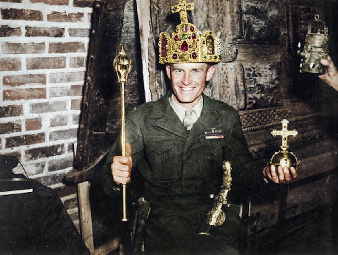 TheNameofWar's tweet photo. American Soldiers Posing With the Imperial Crown of the Holy Roman Empire in a Cave in Siegen, Germany, 1945, colourised https://t.co/mAbRysQBtR