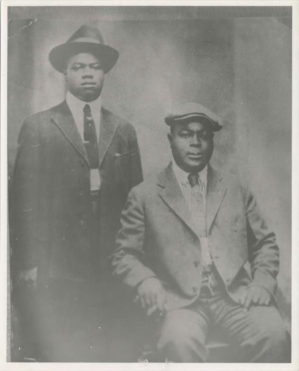 Joe “King” Oliver was one of the New Orleans trumpet and cornet kings who took the instrument to a whole new level. His skills as a musician, composer, and bandleader altered the course of jazz and showcased the genre’s excellence. 

Pictured here is King Oliver with Louis