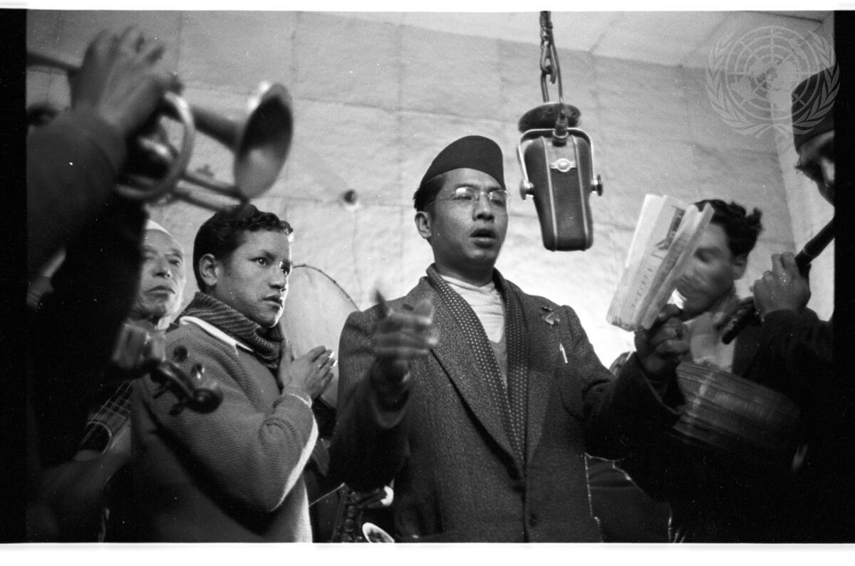 UN_Photo's tweet image. Today is #WorldRadioDay marking the day UN Radio was established in 1946. From war zones to outer space, radio remains essential. 

Here a Nepalese singer sings contemporary folk songs for a radio programme in Kathmandu in 1962.